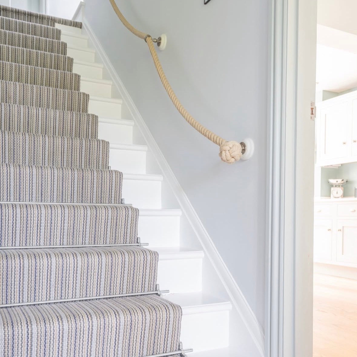 Striped wool stair runner with chrome stair rods